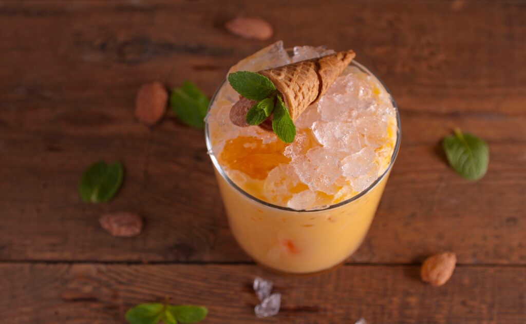 Mango cocktail on wooden tabletop