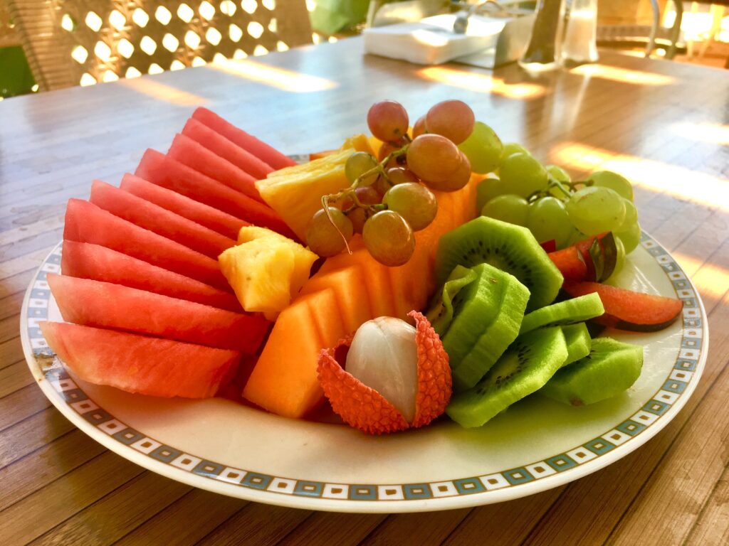 Plate of colorful tropical summer fruits on a plate for health and wellness lifestyle